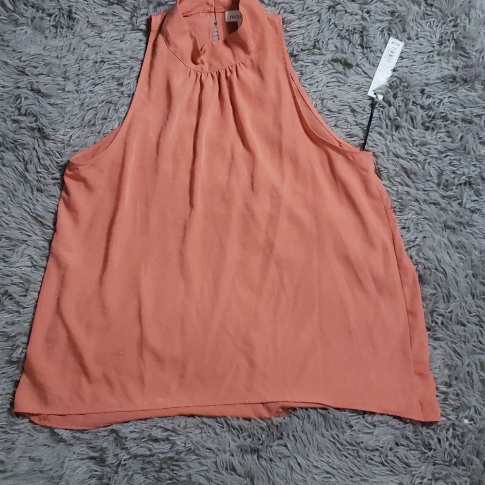 Peach colored shirt